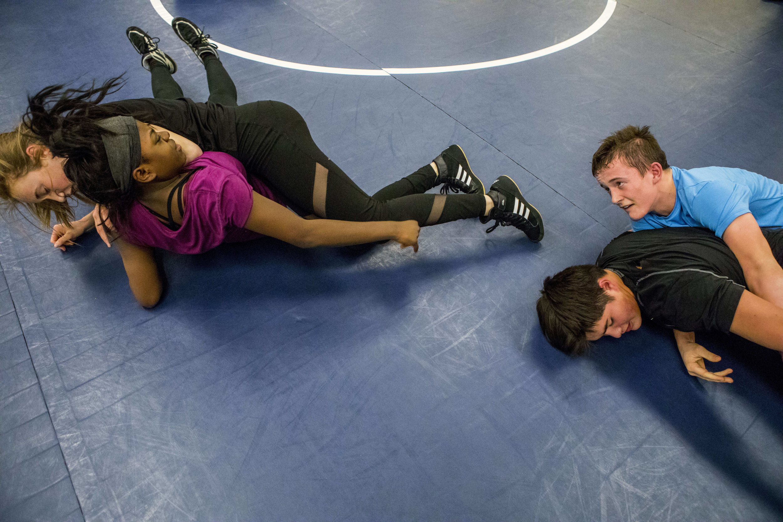  Freshmen Annie Batchen and Elizabeth Jensen, two of four girls on the wrestling team, practice alongside their peers Jack Brown and Henry Hershock during practice in the mezzanine on Feb. 14, 2018 in Jackson, Wyo. 
