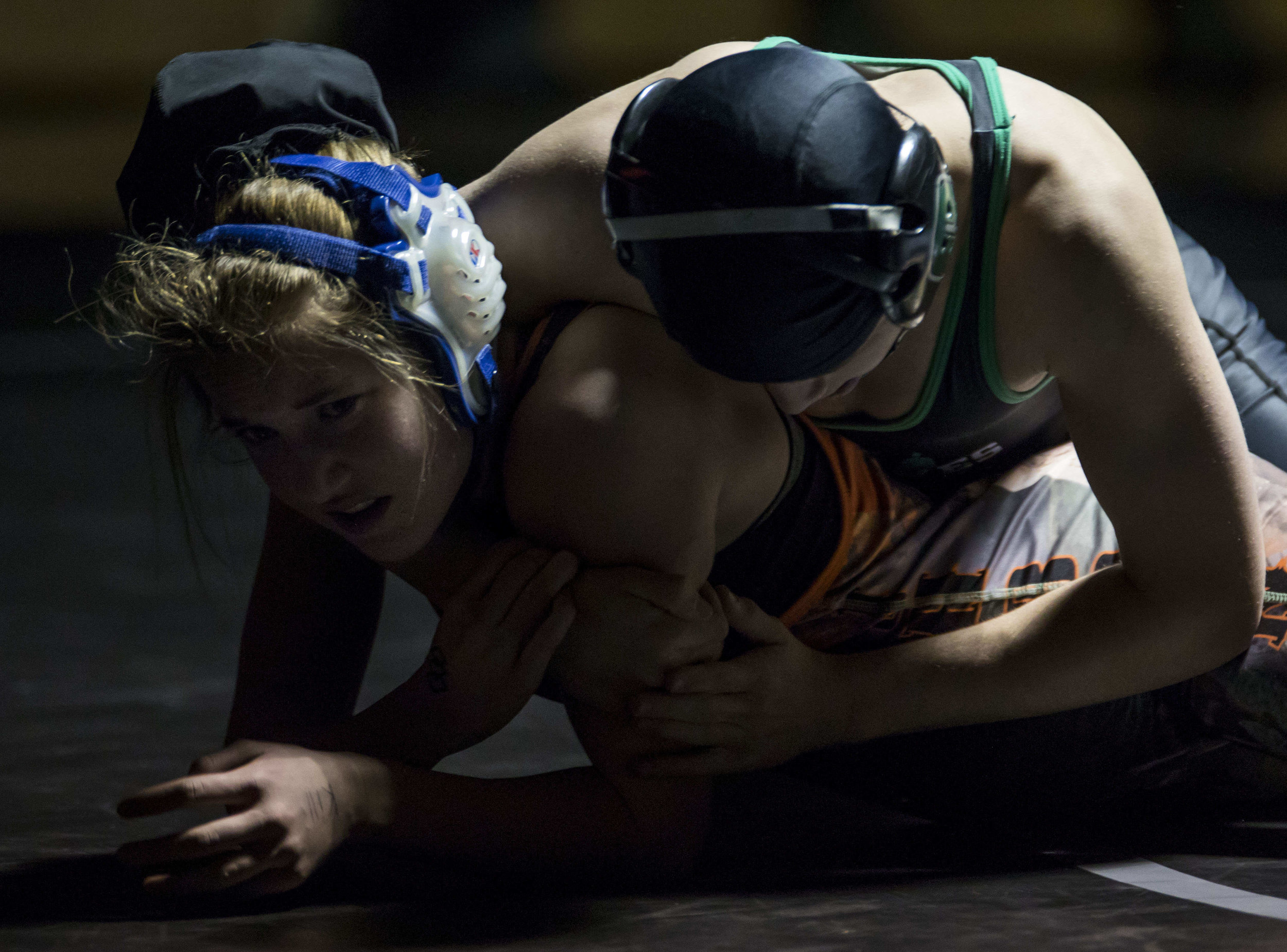  Elizabeth Jensen wrestles her opponent in the 126 weight class while competing in a dual meet against Green River Feb. 9, 2018 at Jackson Hole High School. 