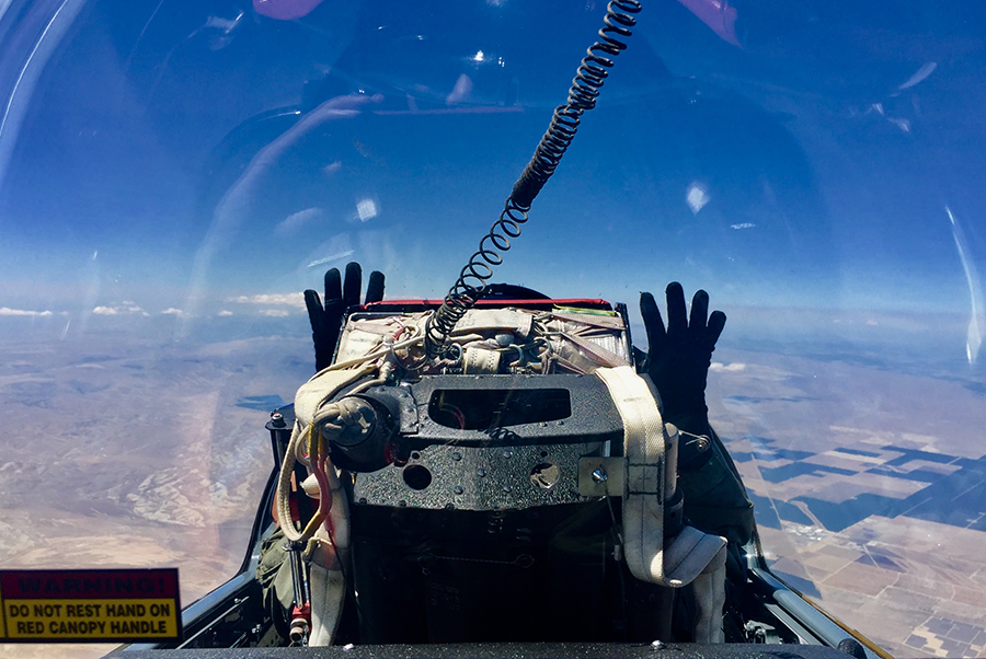 Pilot resting his hands in the air. Someone had to fly the thing...