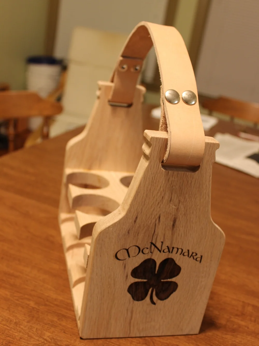  Additional view of the laser engraving and the bottle design for the end plate. &nbsp;The strap is made from 10 oz veg tan leather with snaps. 