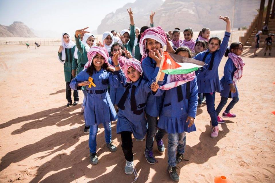 Girls with flag, Wadi Rum football clinic.jpg