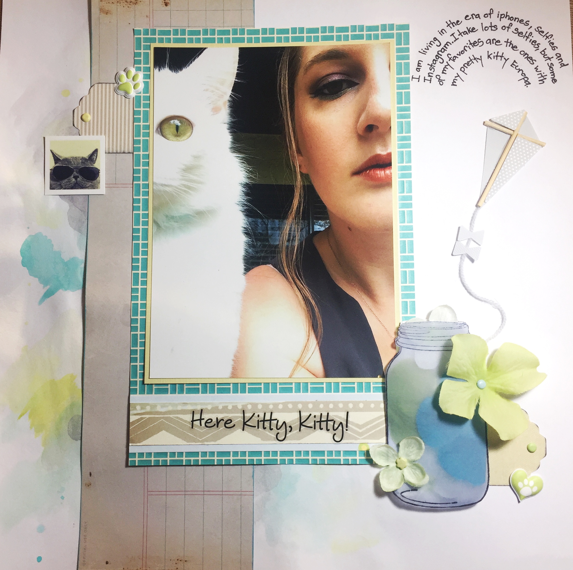 Hello friends and welcome to my very first blog post! At the heart of every scrapbooking page I create is a photo that is important to me. Now that I've acquired a phone with a camera that is superior to my ancient point-and-shoot, I can snap a picture anywhere, anytime. Selfies have become a way of life. This particular photo was taken on my patio where I take many selfies on the days that my makeup turns out nice. (Come on ladies, you know you get excited when your winged eyeliner is on point!) On this particular day my pretty white cat Europa joined me outside and after many attempts, I was able to snap this fun pic of us.