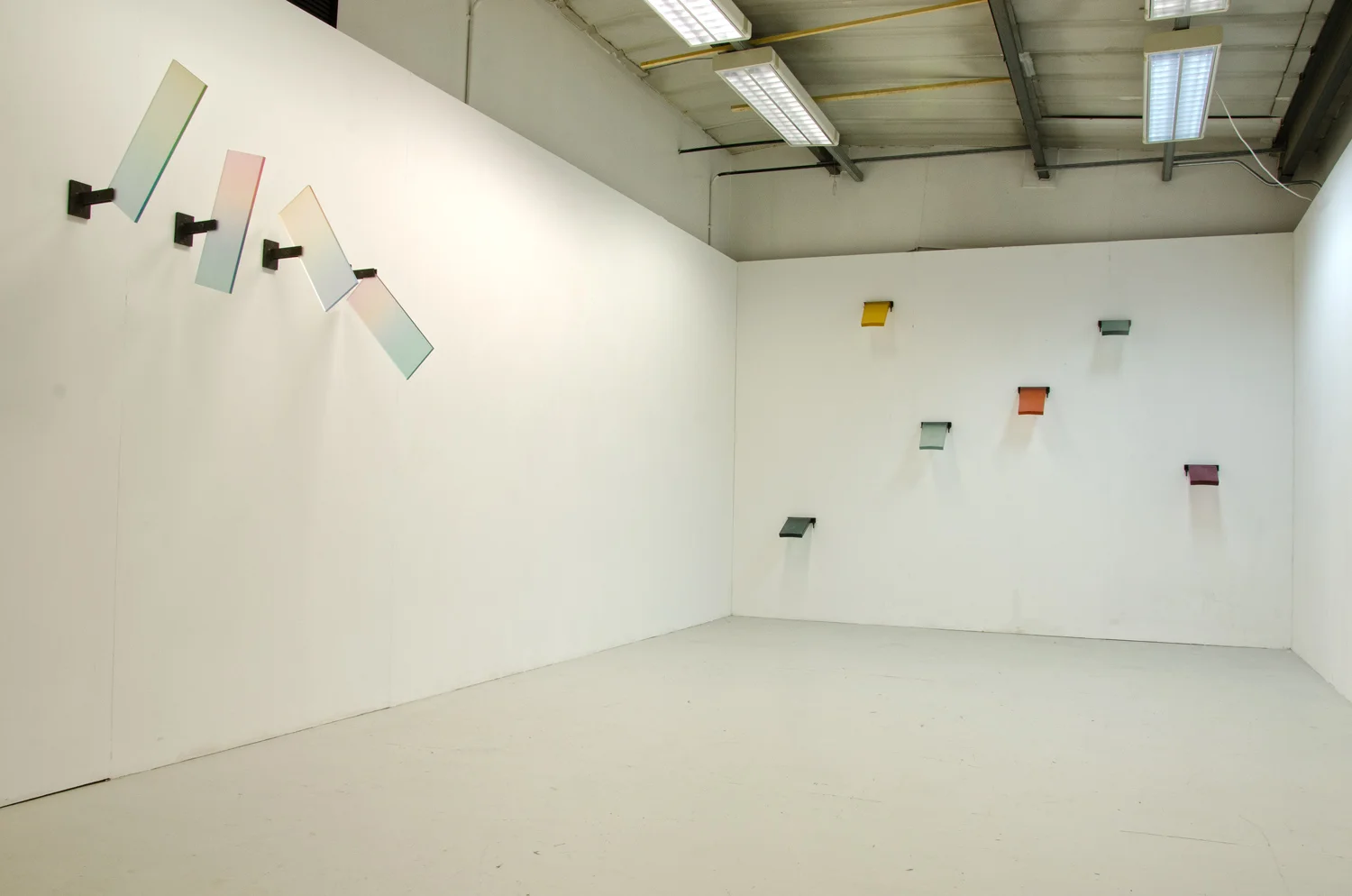 1. Four UV printed perspex sheets with TUP and steel brackets (0.8 x 3 x 0.5m) 2. Six cast translucent tinted resin pieces with steel brackets (2.5 x 3.2 x 0.4m)