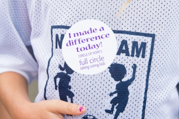 A child's "I made a difference today!" sticker from Full Circle