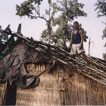  During the rainy season huts get damaged easily by the weather.&nbsp; We have to do repairs often. Dhanapati  / PhotoVoice / LWF  