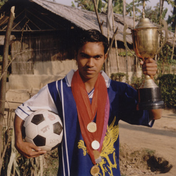   He is the man of the match.&nbsp; He won a shield at a championship.&nbsp; Being a refugee he never looses hope of becoming a football star in Bhutan.&nbsp;     Indra / PhotoVoice / LWF  