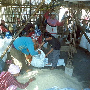 …. Families collect their rations every 15 days. One person hands it out giving everyone the same measurement. Ajay / PhotoVoice / LWF
