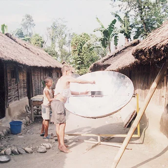Some refugees cook their daily meal in a solar oven. We have to do this because we are not given sufficient kerosene to cook all our meals. Suresh / PhotoVoice / LWF