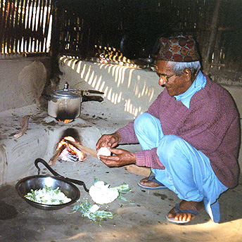  This old man cooks in his hut using firewood.&nbsp; We are given brickettes to use but they burn slowly and do not cook the food properly.&nbsp; We have to buy firewood or collect it ourselves and this is hard for some people.  Abishek / PhotoVoice 