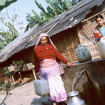   My mother carries the water back to our hut.    Prem / PhotoVoice / LWF  