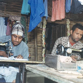 In camp there are people who sew our clothes. These people are important because without them we would have no clothes ready to wear. Due to scarcity of space in the huts he sits outside to sew the clothes. Aite Maya / PhotoVoice / LWF