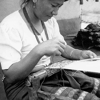 Refugee people have many skills. This woman is weaving a cap to earn extra money. With this income she will be able to buy extra vegetables. In the camp we don’t have an income so we take a lot of trouble to earn money. Bishnu Maya / PhotoVoice / LWF