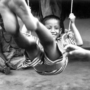 Playing happily on a swing. Here I am a refugee but I do not want refuge. I want the wings to fly. Aite Maya / Devi / PhotoVoice / LWF