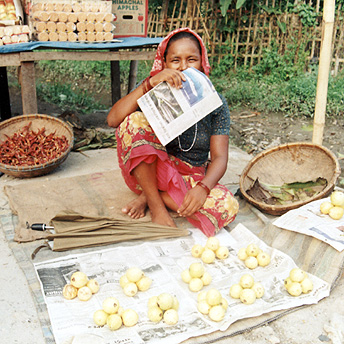   Shopkeeper: A woman selling fruits so she can run her family.    Buddhi/ PhotoVoice / LWF  