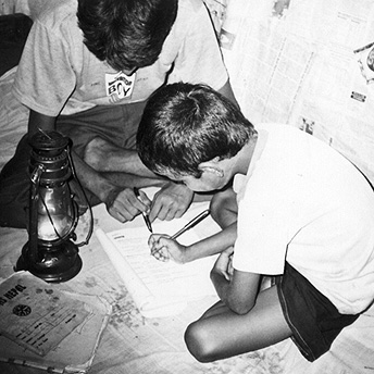   This boy is doing his homework and being helped by his father. Parents are happy to help the school where their children study. They work together to keep the school in good repair to support their children's education.&nbsp; Prem / PhotoVoice / LW