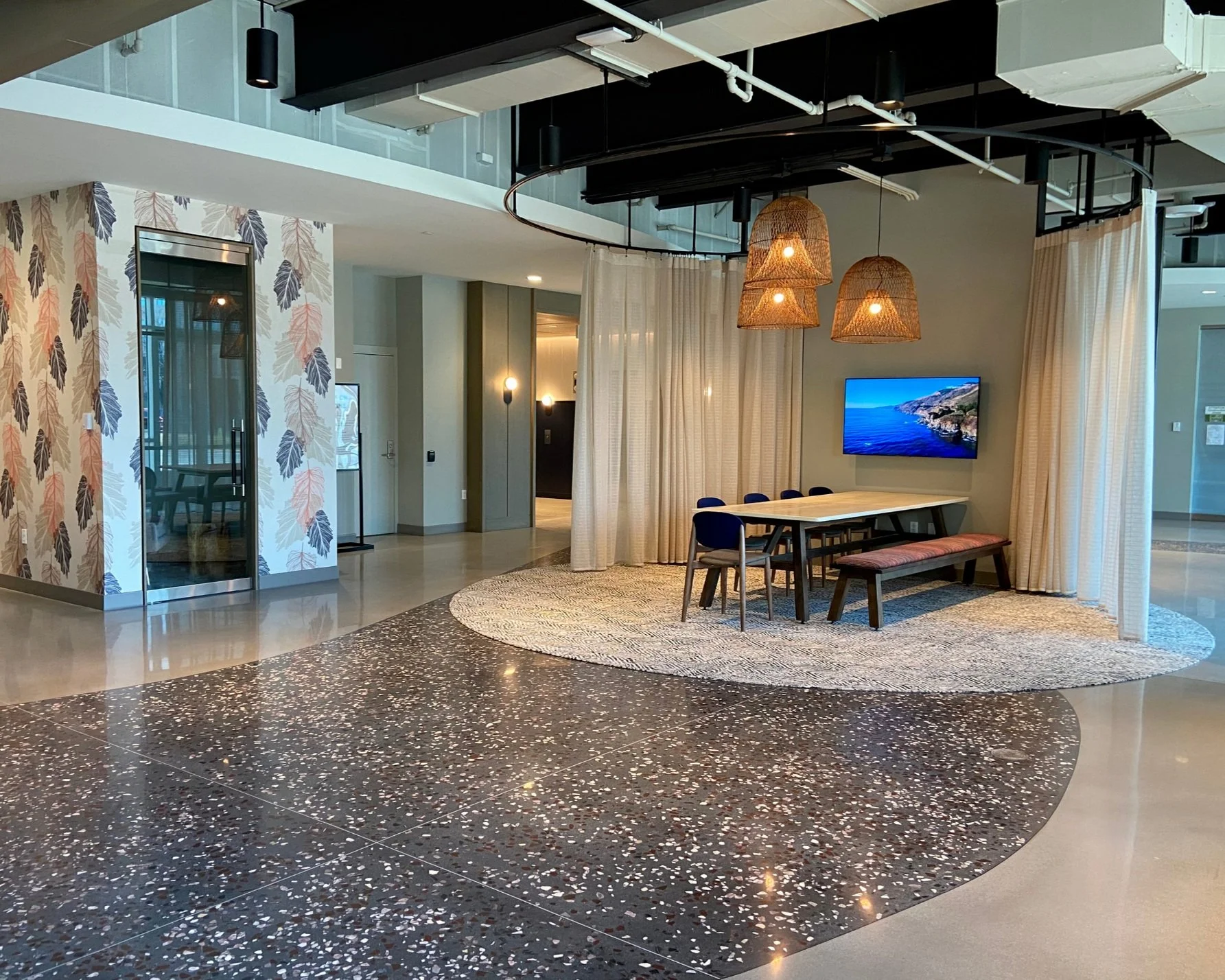 Award-winning polished concrete overlay in Columbia Gateway office amenity space with dual finish pattern, Columbia Maryland