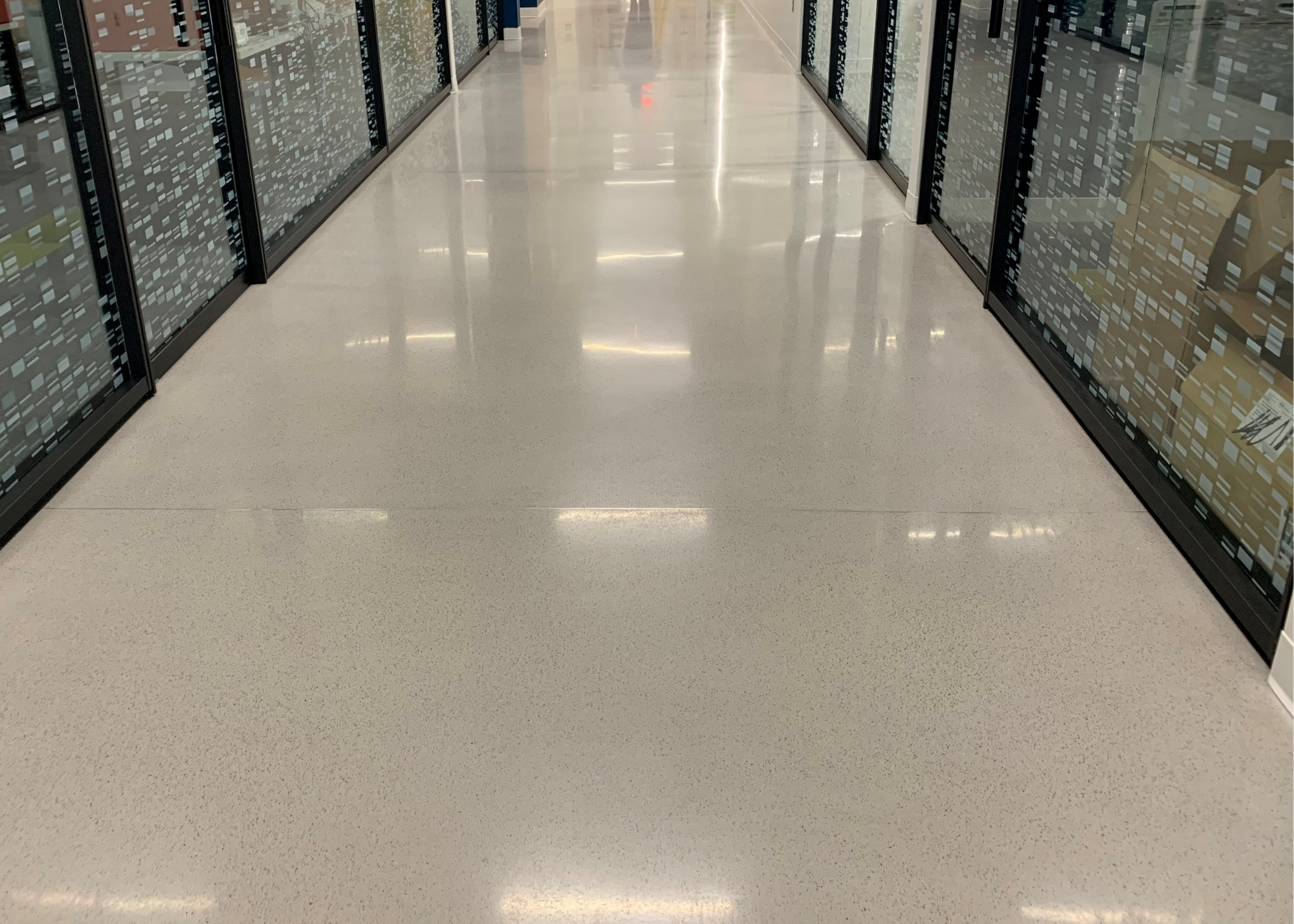 Polished concrete corridor in Regional Clinical Laboratory with reflective high-gloss finish
