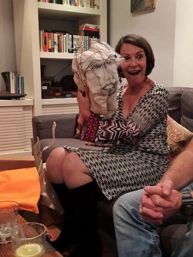 smiling on receiving the head gift.jpg