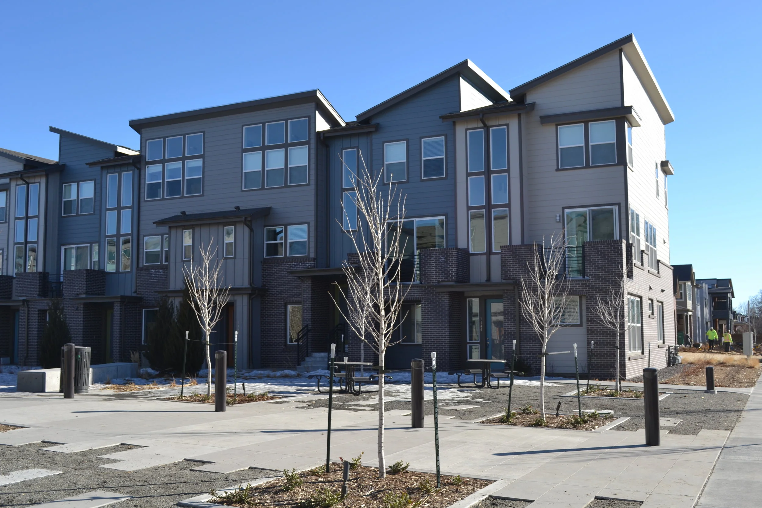 New Town Homes at the former Gates Rubber factory site on land previously zoned Industrial that STARBOARD rezoned to Transit Mixed Use Zoning, enabling new infill development. 