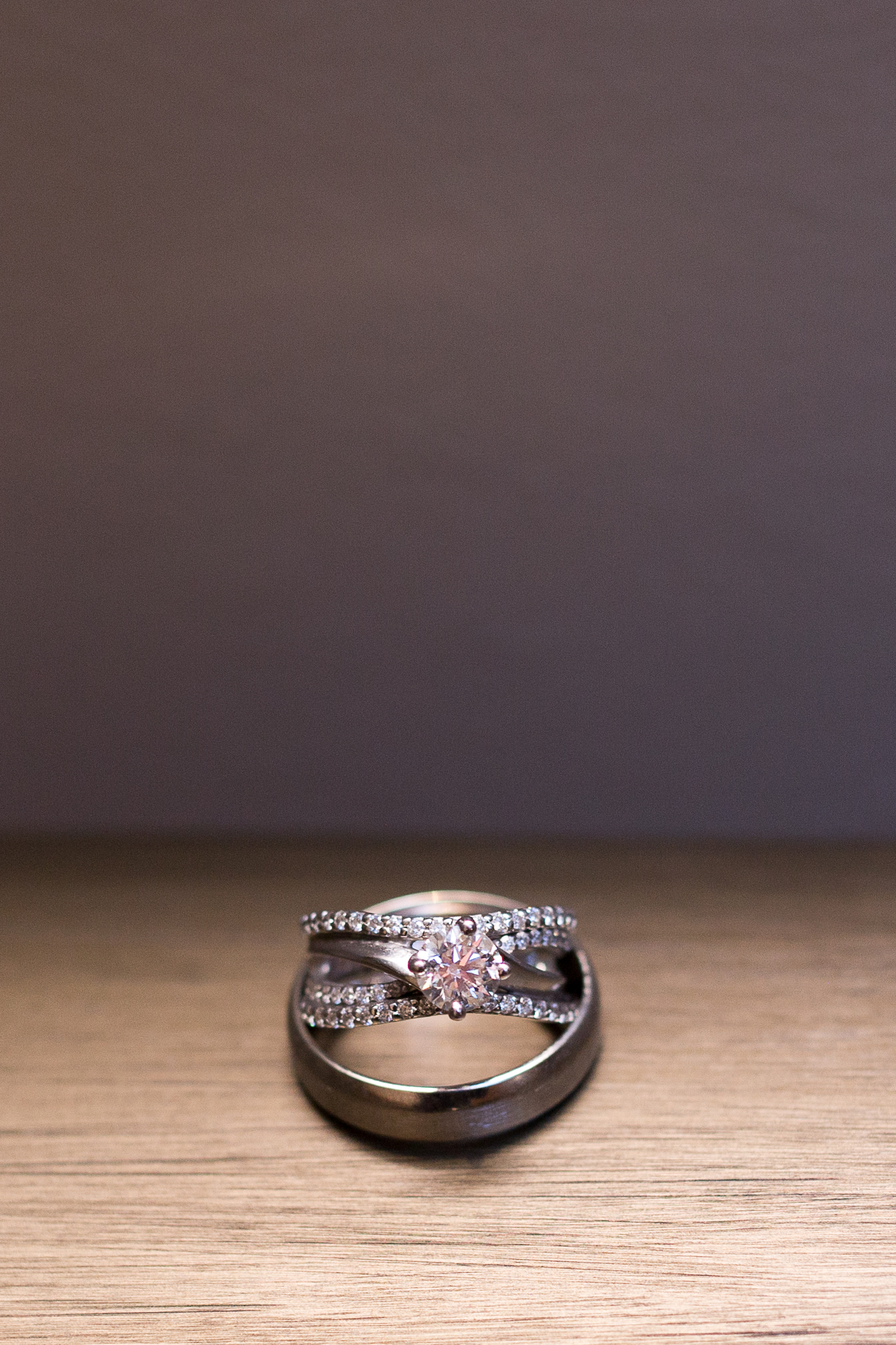 Diamond ring resting in the groom's ring in Colorado  Springs Stacy Carosa Photography