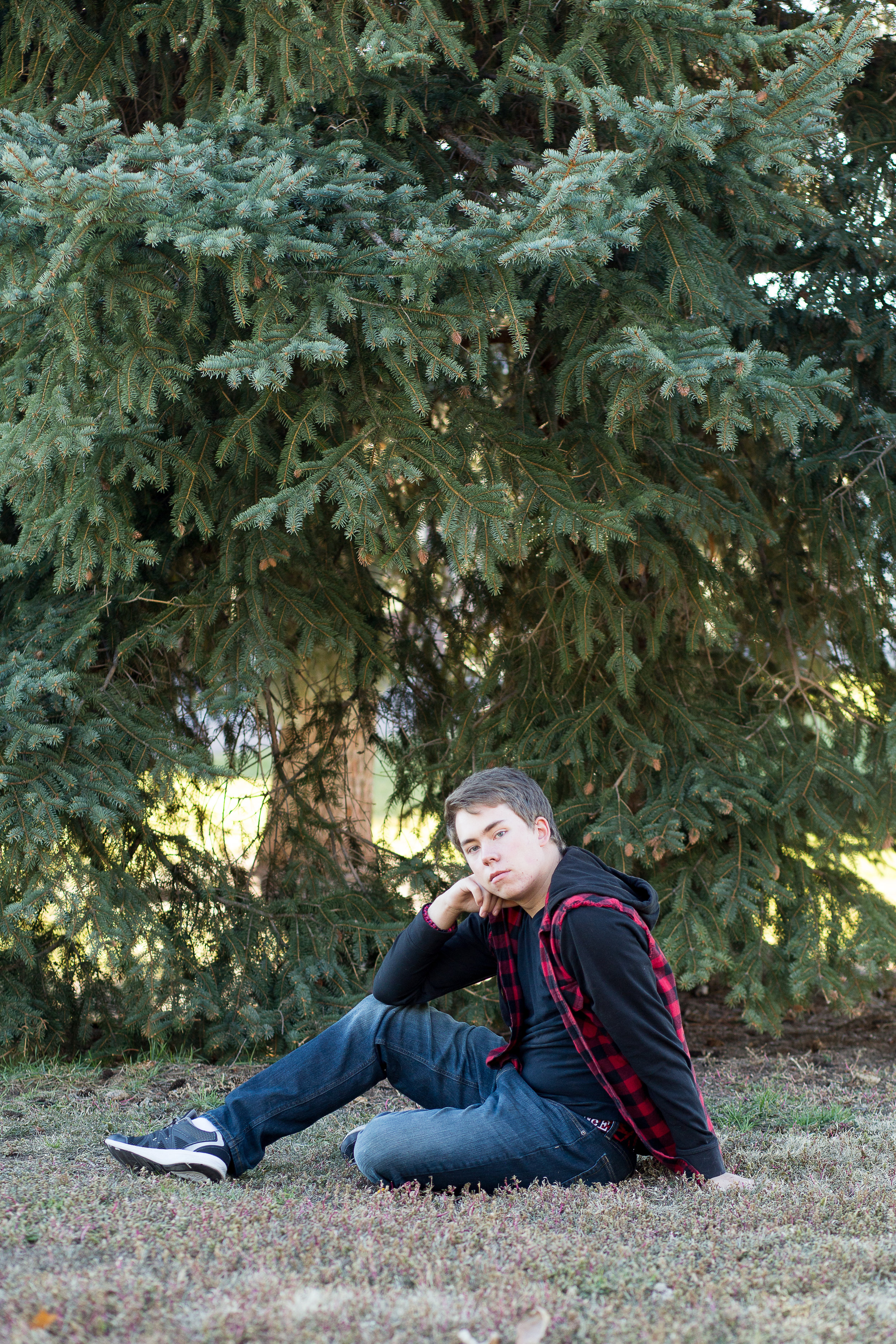 Stacy Carosa Photography | Colorado Springs Senior Photographer | senior boy standing near pine trees for senior session photos in the fall