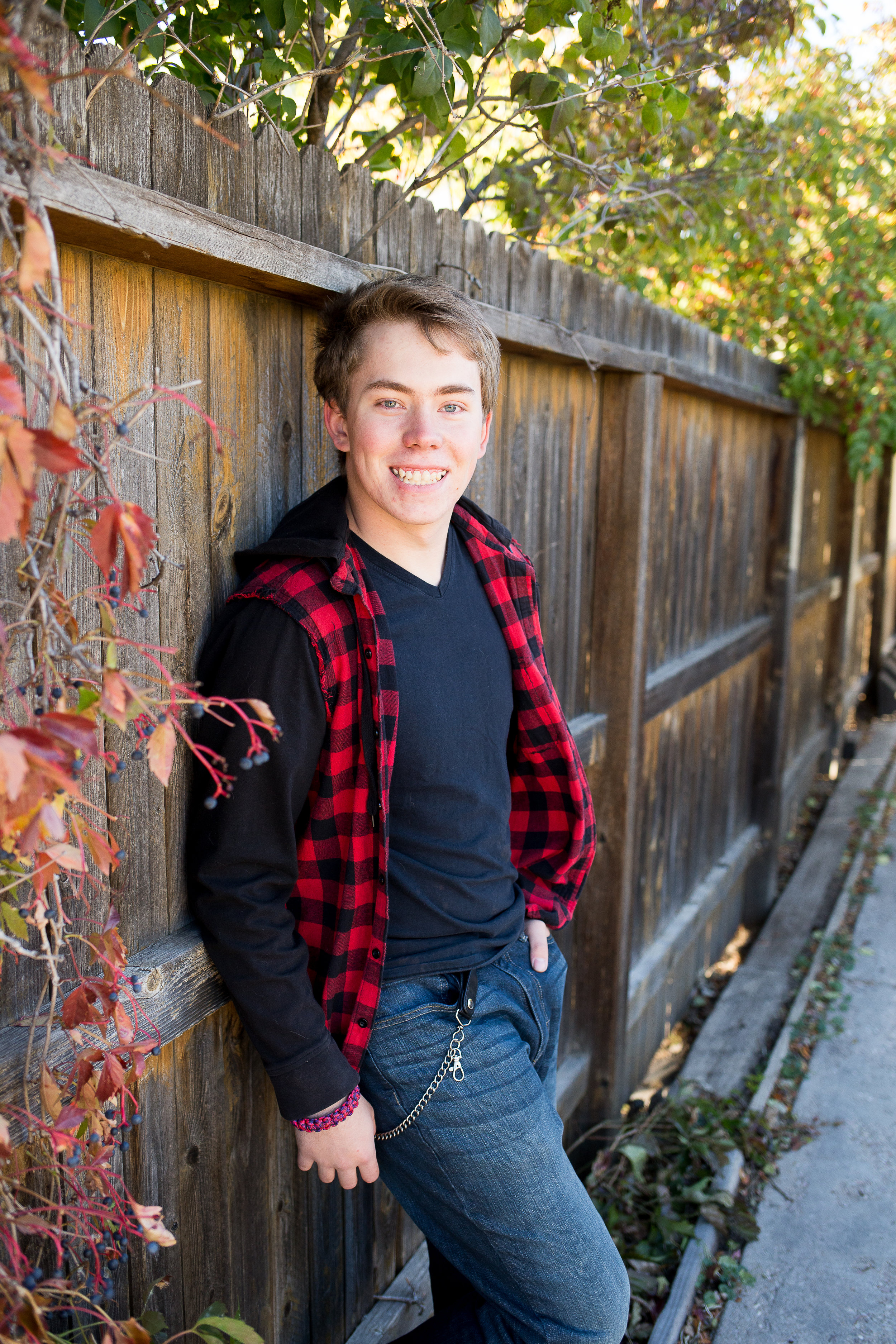 Stacy Carosa Photography | Colorado Springs Senior Photographer | senior boy standing near fall colors for senior session photos