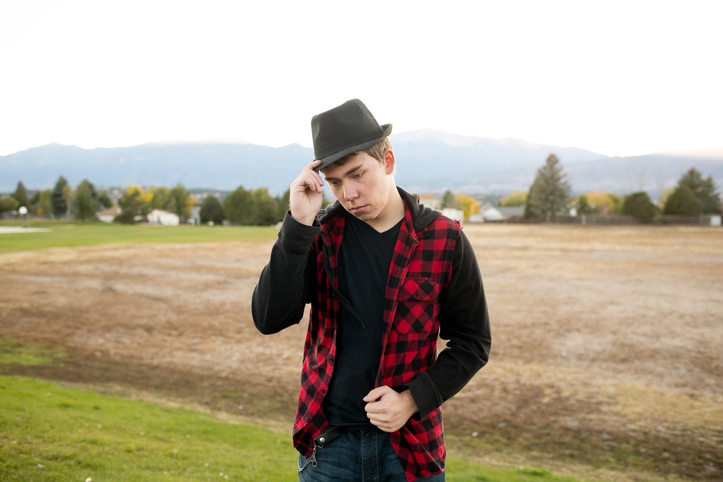 Stacy Carosa Photography | Colorado Springs Senior Photographer | senior boy standing near fall colors for senior session photos