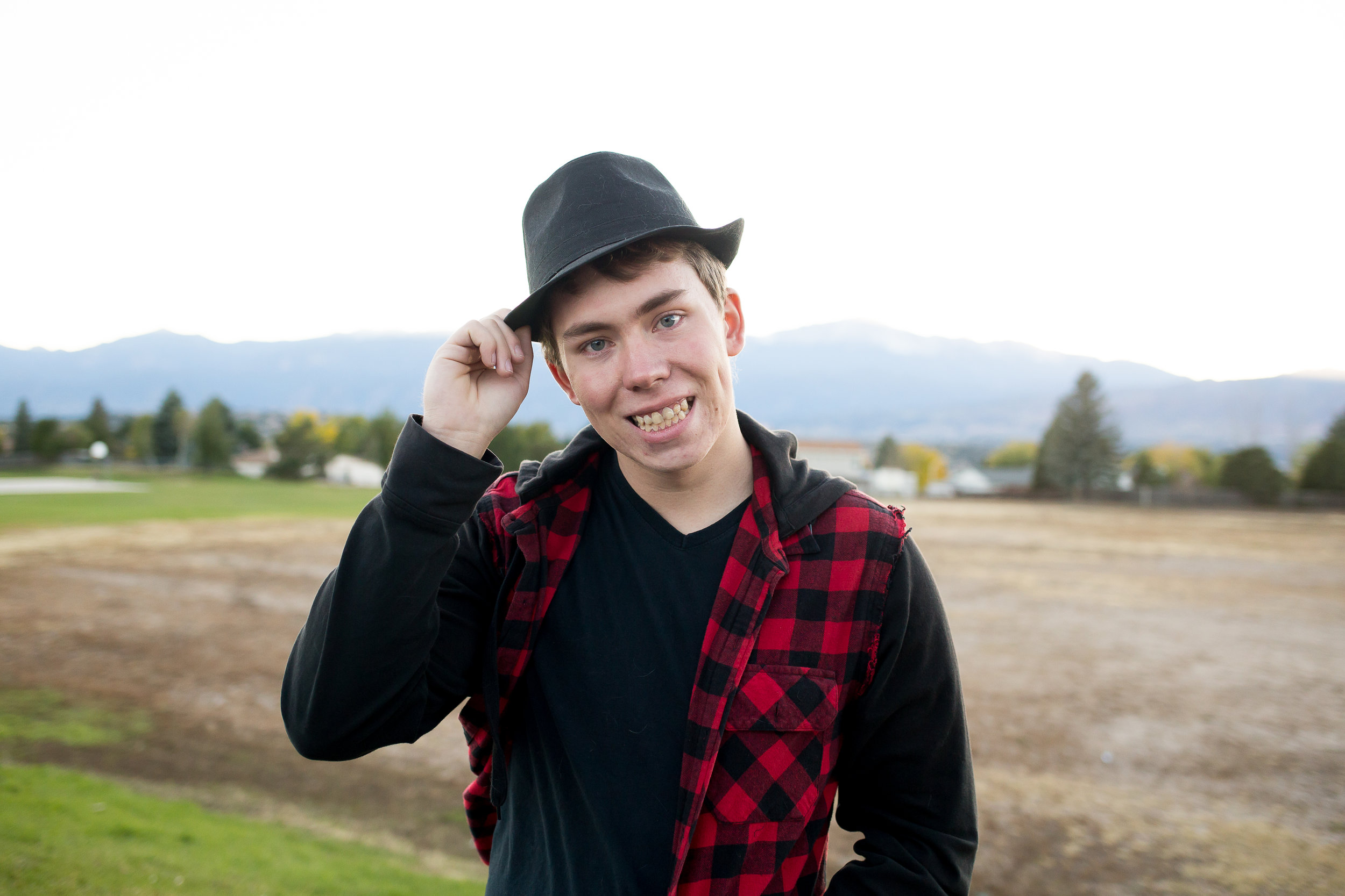 Stacy Carosa Photography | Colorado Springs Senior Photographer | senior boy standing near fall colors for senior session photos