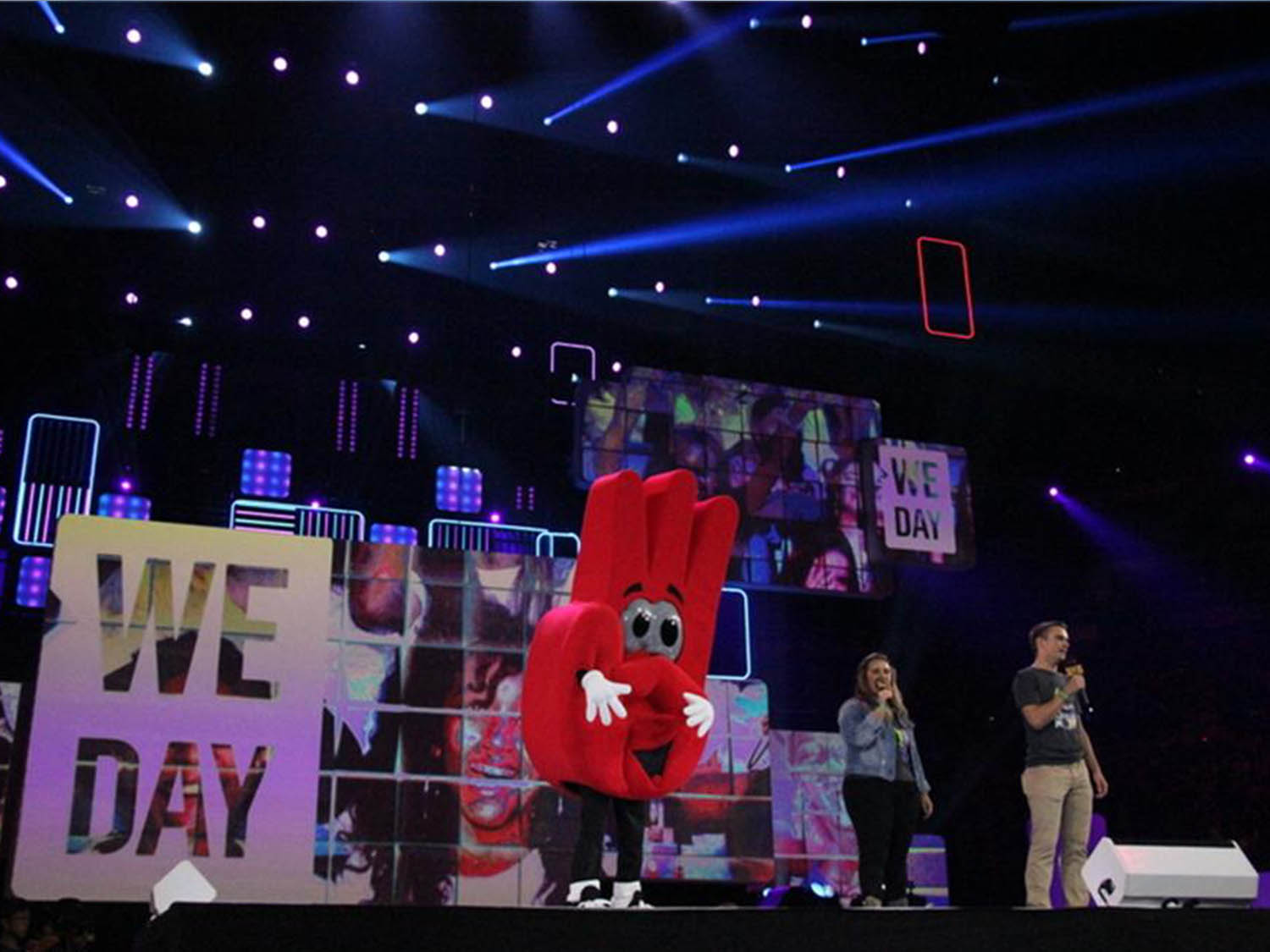 we day hand mascot costume on stage