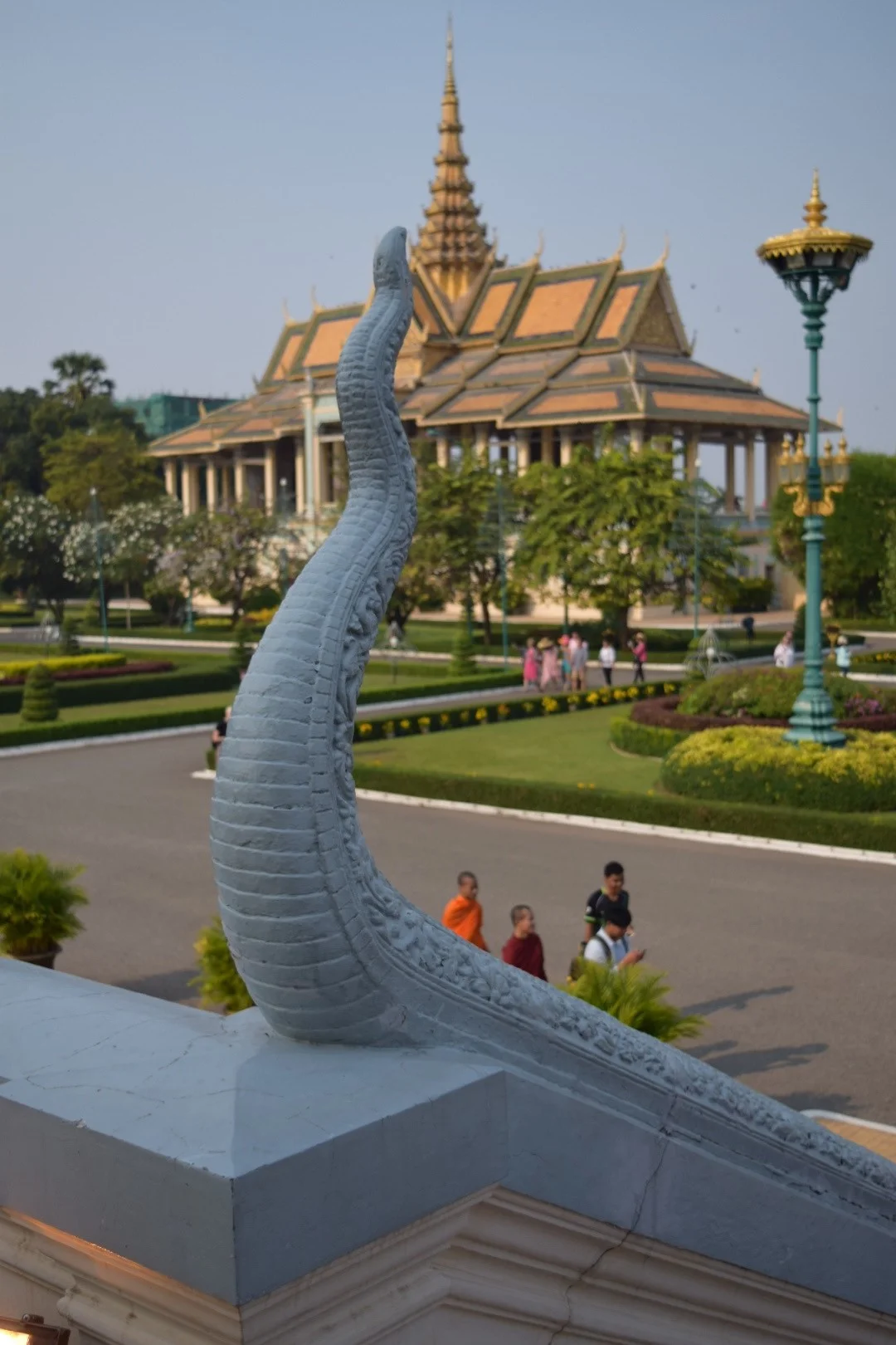 "Nagas" (serpents) are a symbol of prosperity. They represent the land and water of the Khmer. This naga makes its presence known from the top steps of the Throne Room. Behind it is the Moonlight Pavilion, which is a venue for the Royal Dancers and for state and royal banquets. It is also used for the King to address crowds on the Royal Palace grounds. 