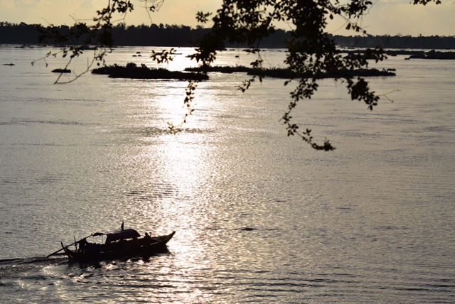 The sun begins to set on the Mekong River.