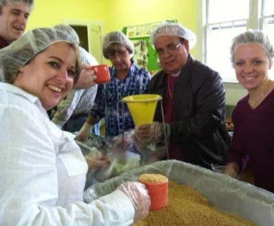 St. John's volunteers package 10,000 meals in our fellowship hall.