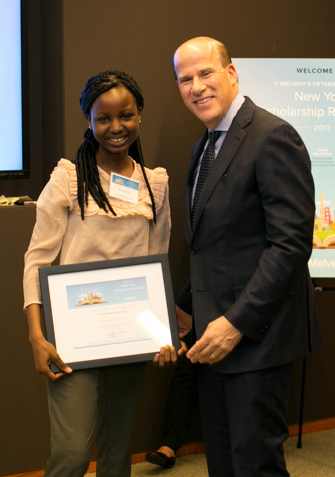 Mastan receiving her award from O’Melveny’s New York Managing Partner, Jeffrey Kohn