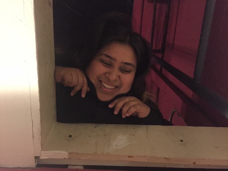 Daisy Hernandez looking down from the spotlight booth.