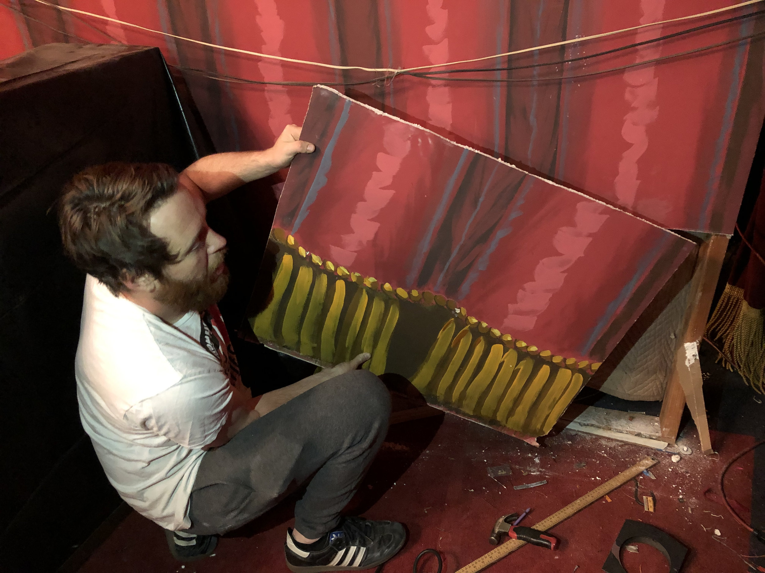 Our daring Executive Director / Head Puppeteer Alex Evans cutting out curtains in the dead of night.