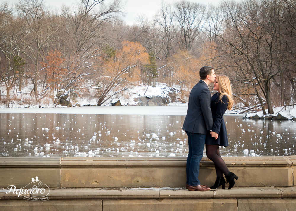 engaged couple kissing by Bethesda Fountain