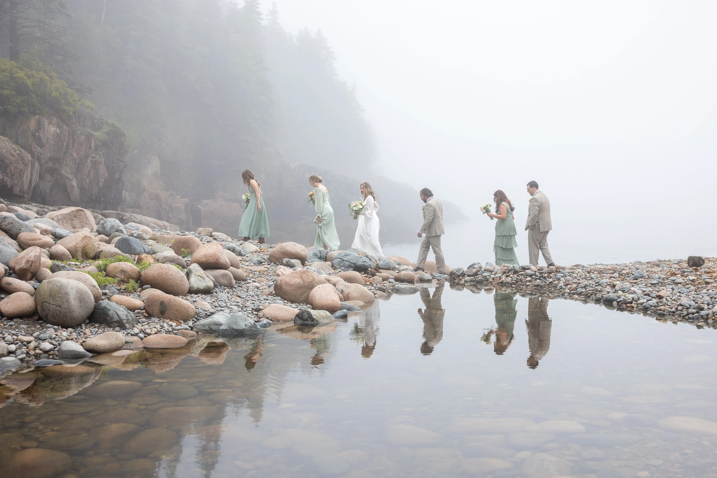 foggy spring wedding at hunters beach with reflections of bride and groom in the lagoon