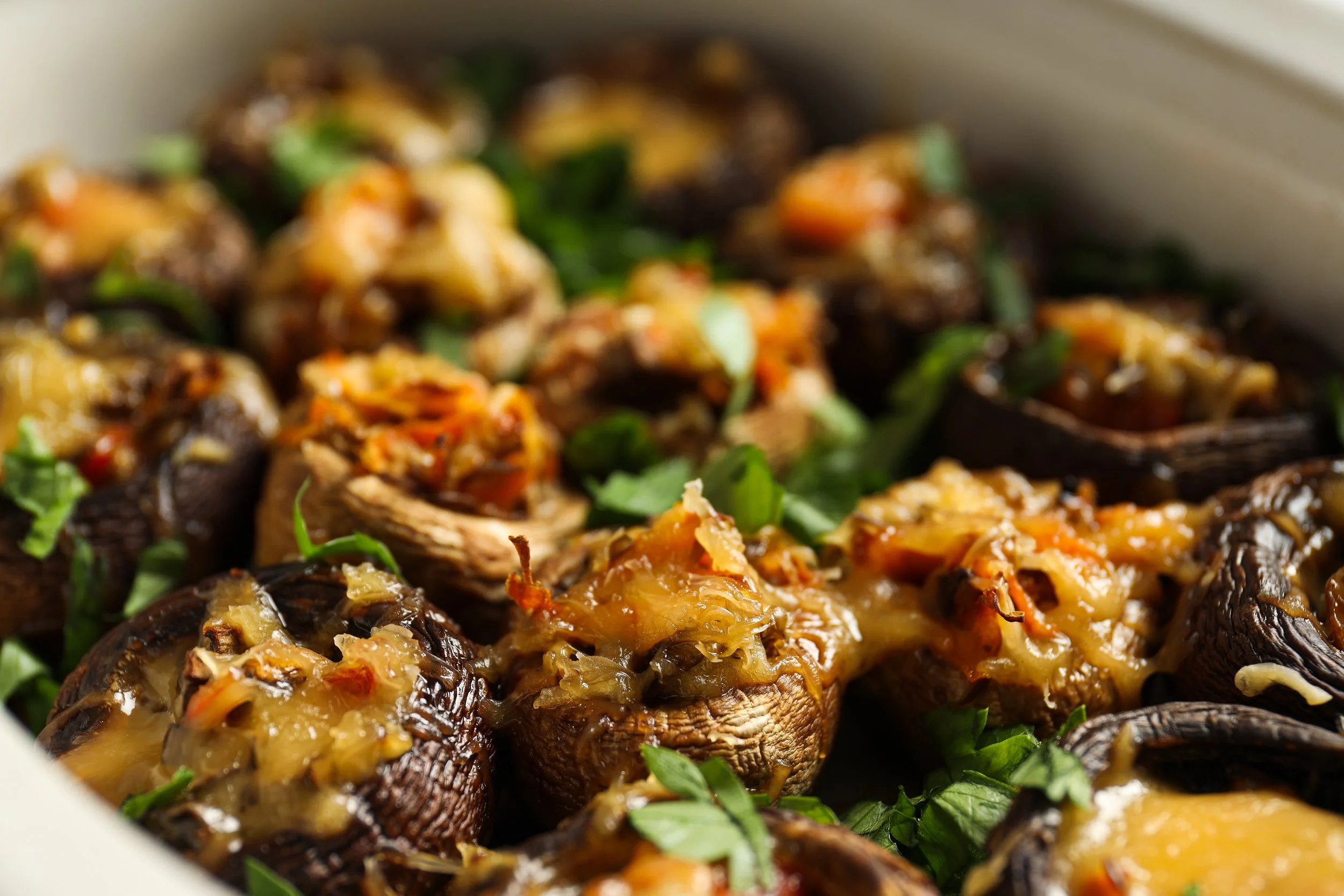 stuffed-mushrooms-with-cheese-light-background-close-up.jpg