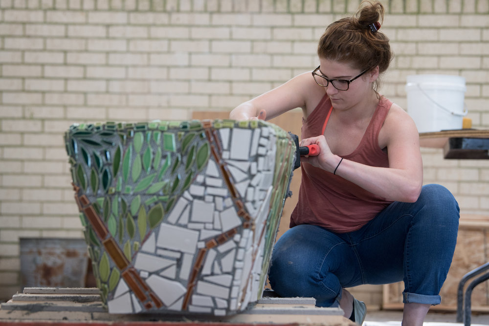  A student grouting the bench.  Photo by Michael Spooneybarger 