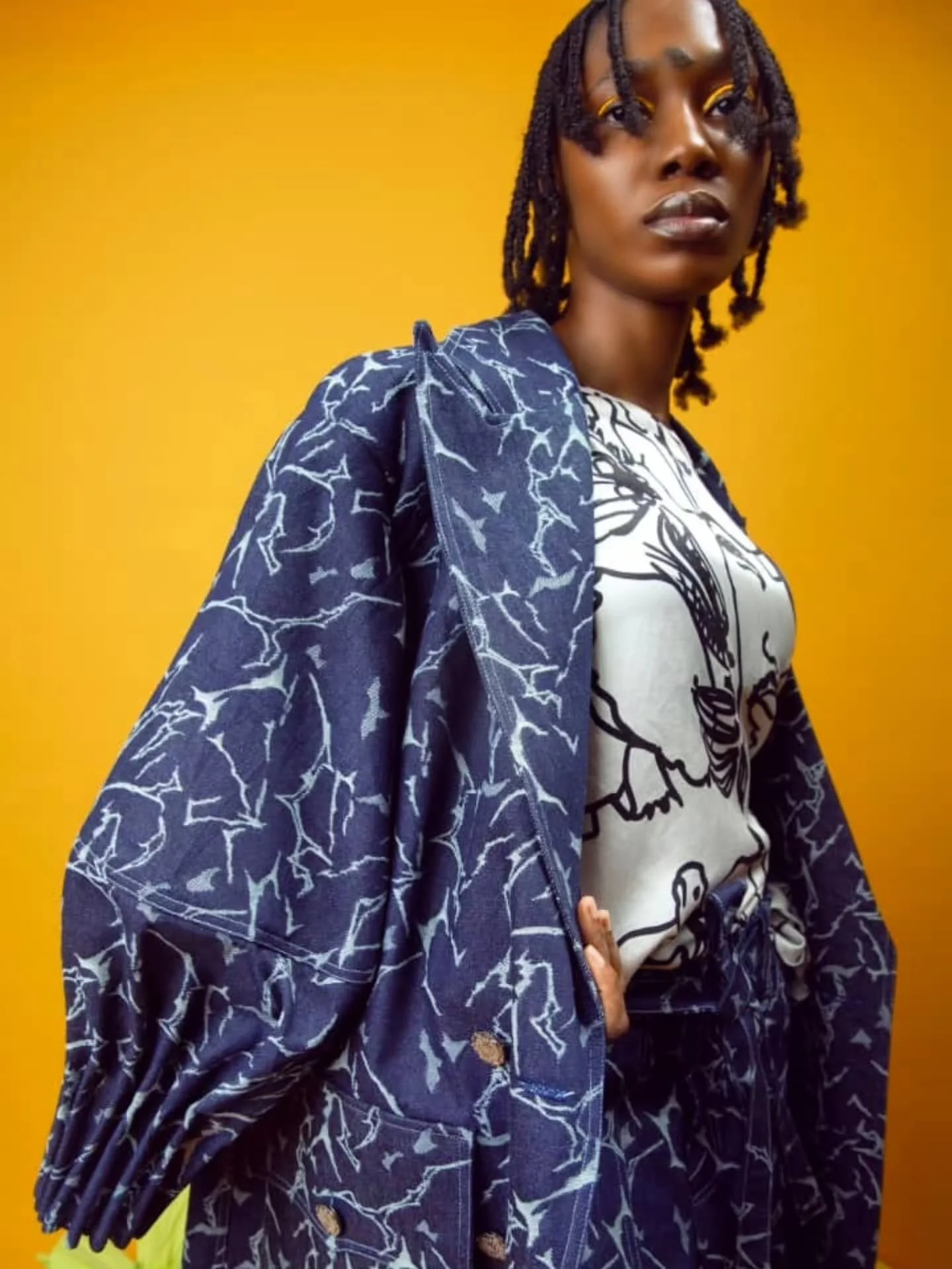 "Who is in the Garden"

Step into bold elegance with our Cracked weave Denim Coat &mdash; beautifully crafted with lantern sleeves and intricate tuck details.
Paired with matching pants finished with a luxurious touch of red velvet trimming