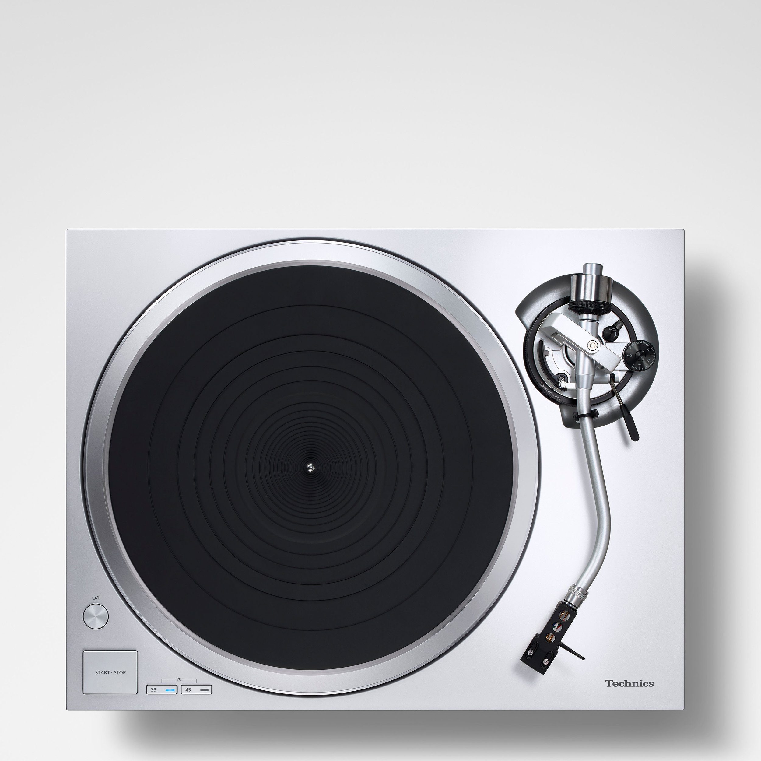 Top view of the Technics SL-1500C direct drive turntable shown in silver.