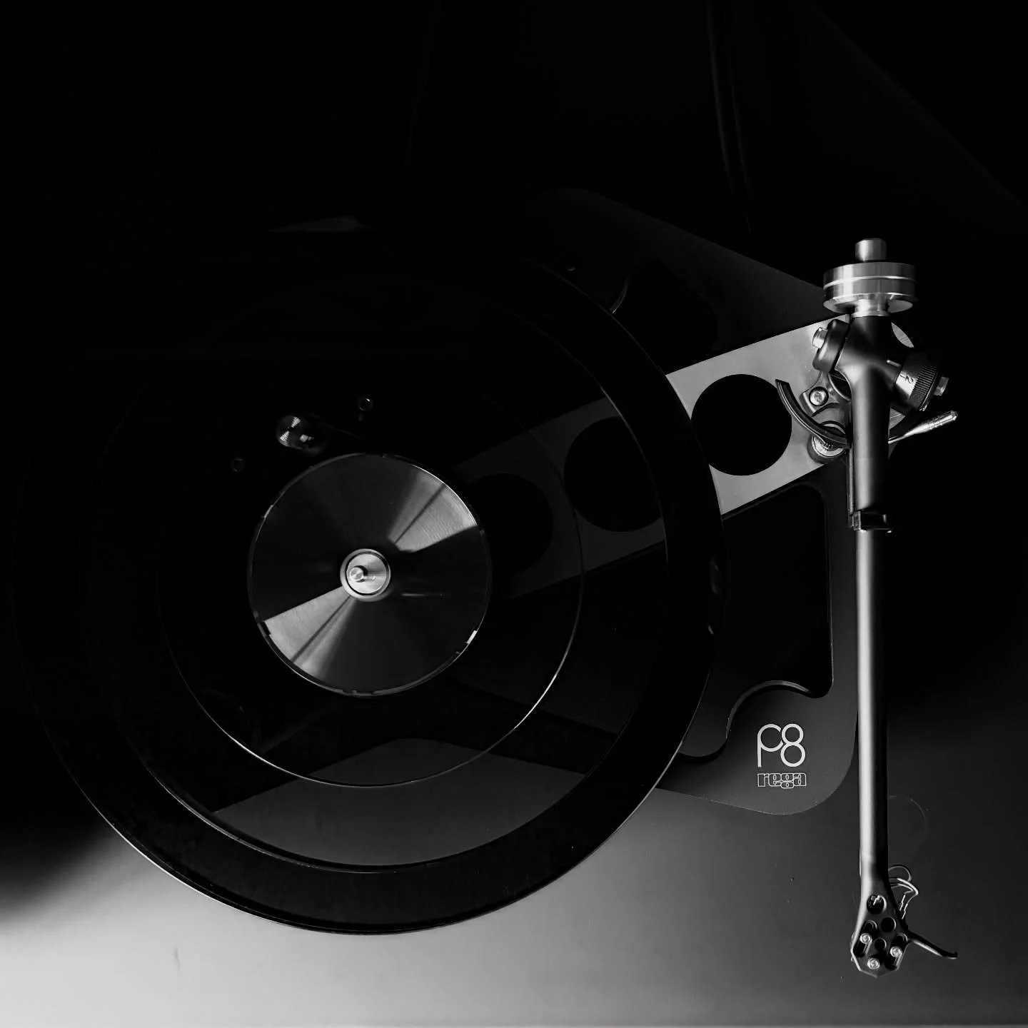 Playing in the shadows, the Rega Planar 8 turntable.
 
Rega is an engineering company passionate about music. The Planar 8 makes music like no other record player at the price.
 
Visible:
 
➡️ Heavy triple layer glass platter for enhanced flywheel ef