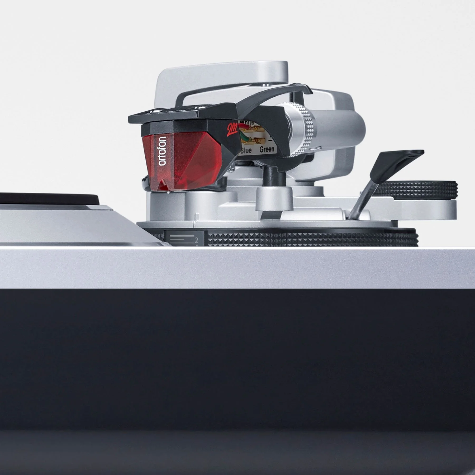 Close-up detail of the Ortofon 2M Red cartridge pre-installed on the Technics SL-1500C.