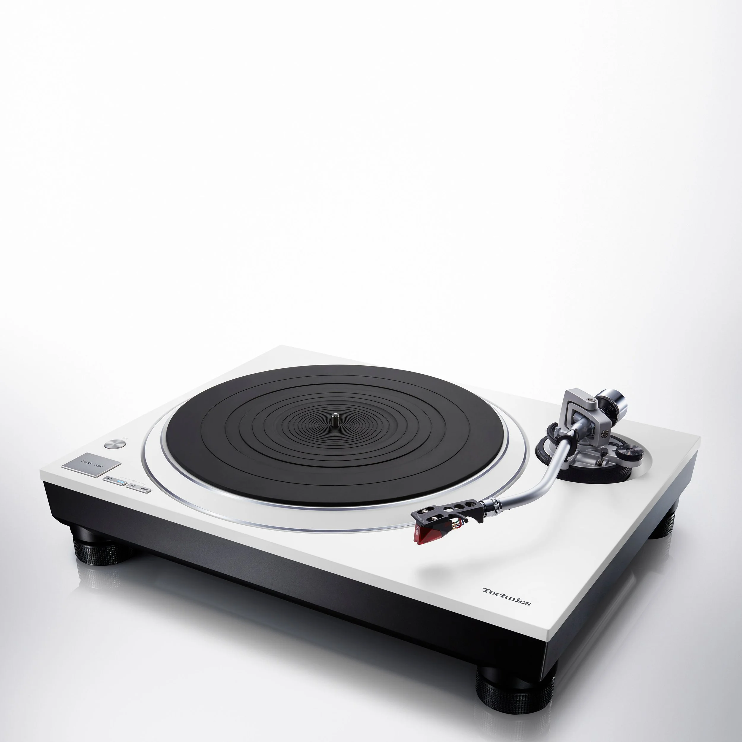 Angled view of the Technics SL-1500C direct drive turntable in white.