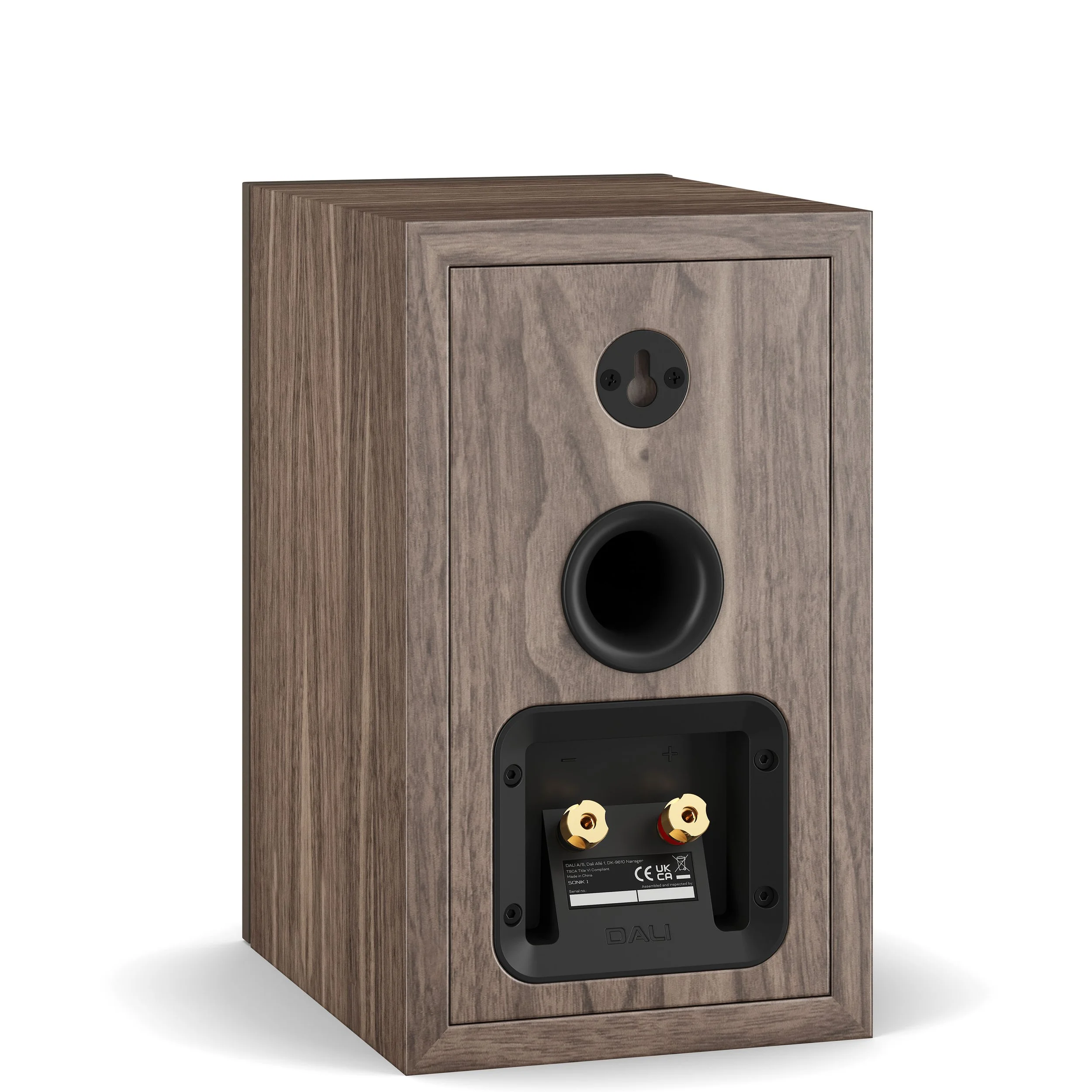 Back view of the DALI Sonik 1 bookshelf speaker showing gold binding post connectors, rear port, and keyhole wall mount.