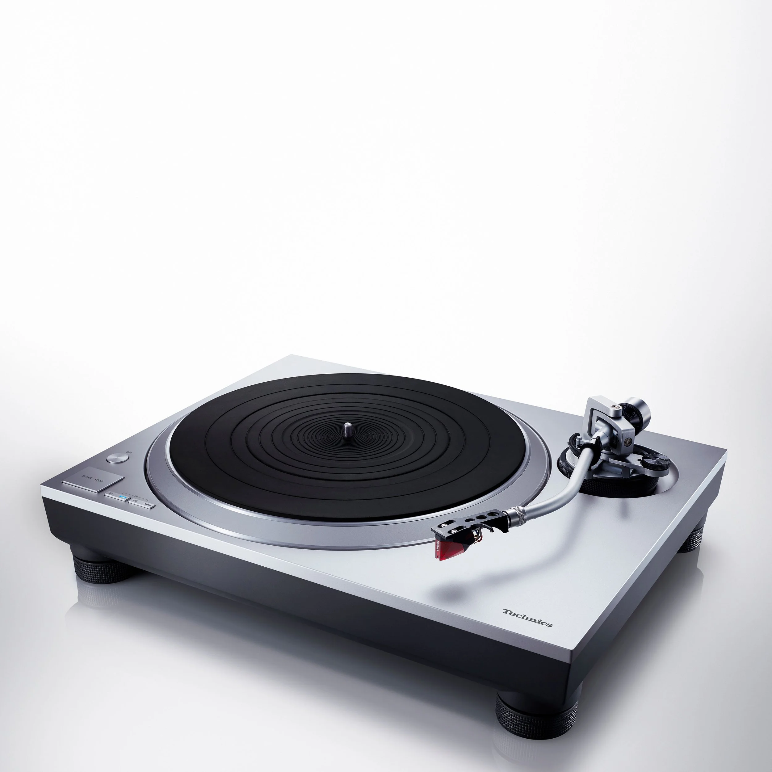 Angled view of the Technics SL-1500C direct drive turntable in silver.