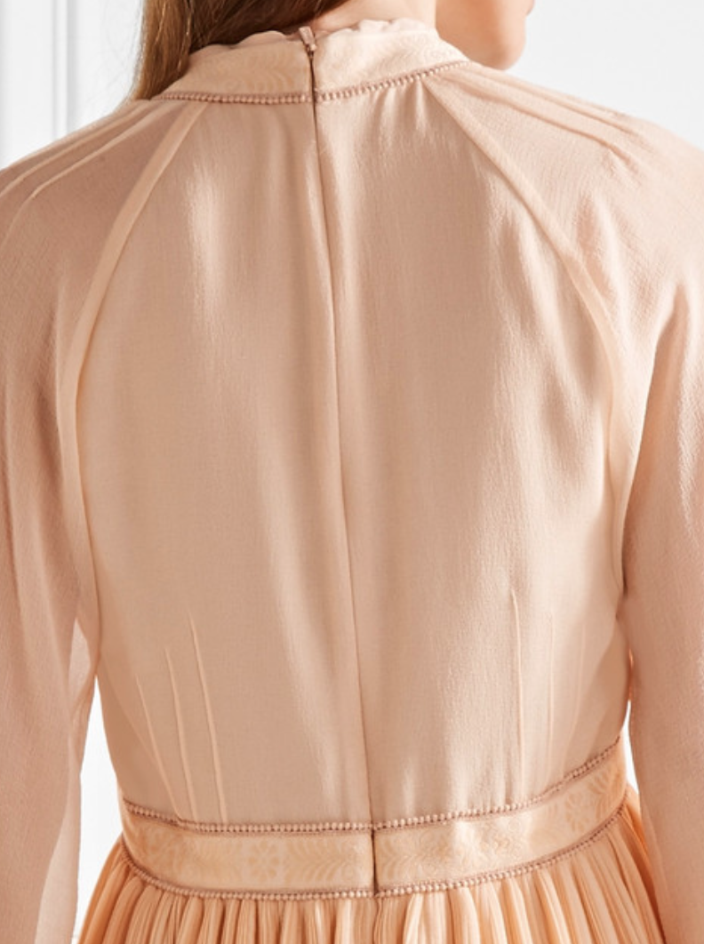 Here this Chloe dress shows a concealed zip at the centre back, the only part of the zip you can see is the puller at the top.