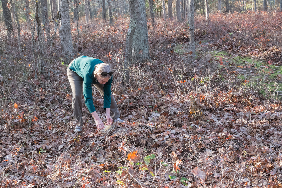 Ann setting temporary marker stone on her father's grave. photo: Tom Bailey.