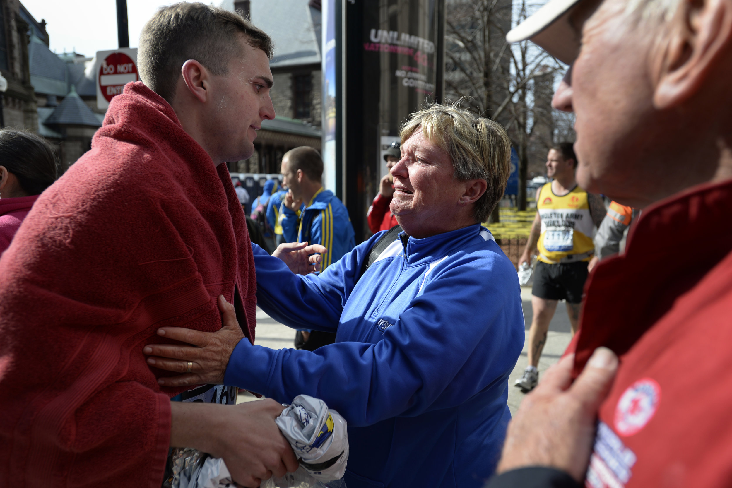 Karen Terry, right, is reunited with Sean Terry after two bombs exploded near the finish line of the Boston Marathon on April 15, 2013.