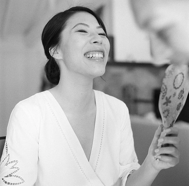 3-bride-laughing-holding-mirror.jpg